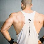 Burn Fat, Build Muscle - Backview of Brawny Man with Broad Shoudlers in White Tank Top
