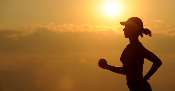 Boost Endurance - Woman With White Sunvisor Running
