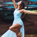 Balanced Fitness - Woman Standing While Wearing Blue Sleeveless Dress