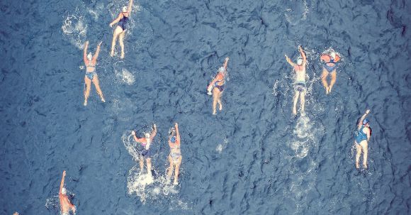 Speed Challenge - Aerial view of swimmers during competition in sea