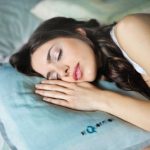 Sleep - woman sleeping on blue throw pillow
