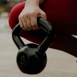 Digestive Fitness - Close up of Woman Holding Dumbbell