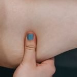 Weight Loss Power - Crop unrecognizable plus size female demonstrating arm flabby muscles before weigh lose workout