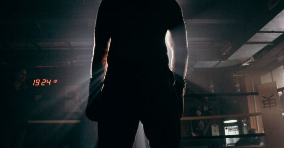 Sports-specific Training - Man in Black Shirt and Pants Standing on the Floor