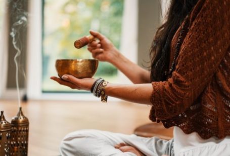 Meditation - woman in brown knit sweater holding brown ceramic cup