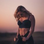 Weight Loss - woman standing on the field during sunset