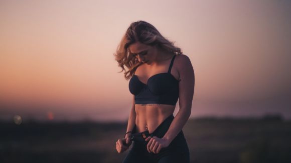 Weight Loss - woman standing on the field during sunset