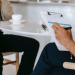 Expert Support - Crop faceless multiethnic interviewer and job seeker going through interview