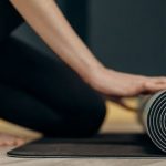 Mindfulness, Tranquility. - Woman Rolling A Yoga Mat