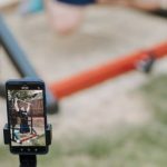 Online Coaching - Man recording video of training on horizontal bar