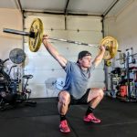 Cardio Exercises - man lifting yellow barbell