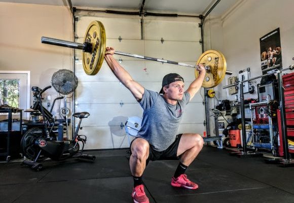 Cardio Exercises - man lifting yellow barbell