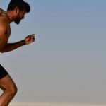 Cardio Integration - Strong shirtless sportsman jogging on bright day