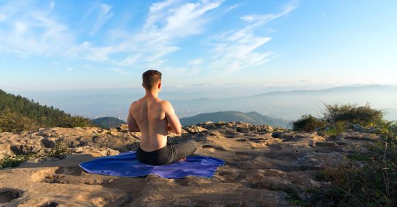 Meditation Integration - Shirtless Man Meditating on Mountain Top