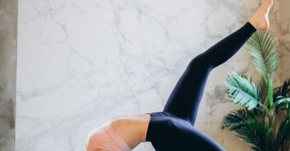 Strength + Yoga - Woman Practicing Yoga