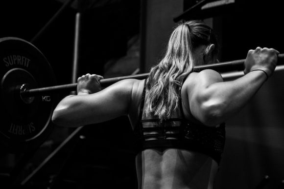 Sport Training - woman lifting barbell
