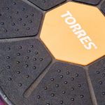 Strong Core - High angle of balance rotating fitness disc laced on purple mat in sports studio