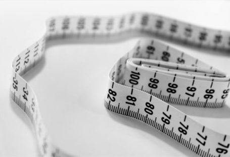 Weight Loss - selective focus photography of tape measure