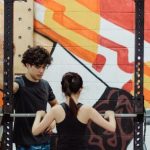 Sports Training - Young Athletes Lifting Weights at Gym with an Orange Mural