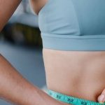 Weight Loss Programs - Fit Woman Using Measuring Tape
