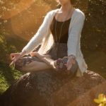 Myth-busting Fitness - Woman Meditating on Rock