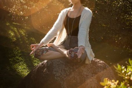Myth-busting Fitness - Woman Meditating on Rock