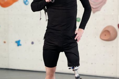Fit Challenge - Man in Black Long Sleeve Shirt and Black Shorts Standing With Prosthetic Leg