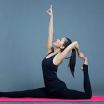 Yoga Poses - woman in black tank top lying on red textile