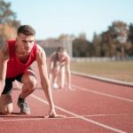 Cardio Tips - Strong sportsmen ready for running on stadium