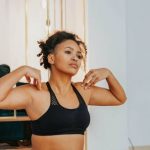 Online Fitness - A Woman in Activewear Doing Yoga